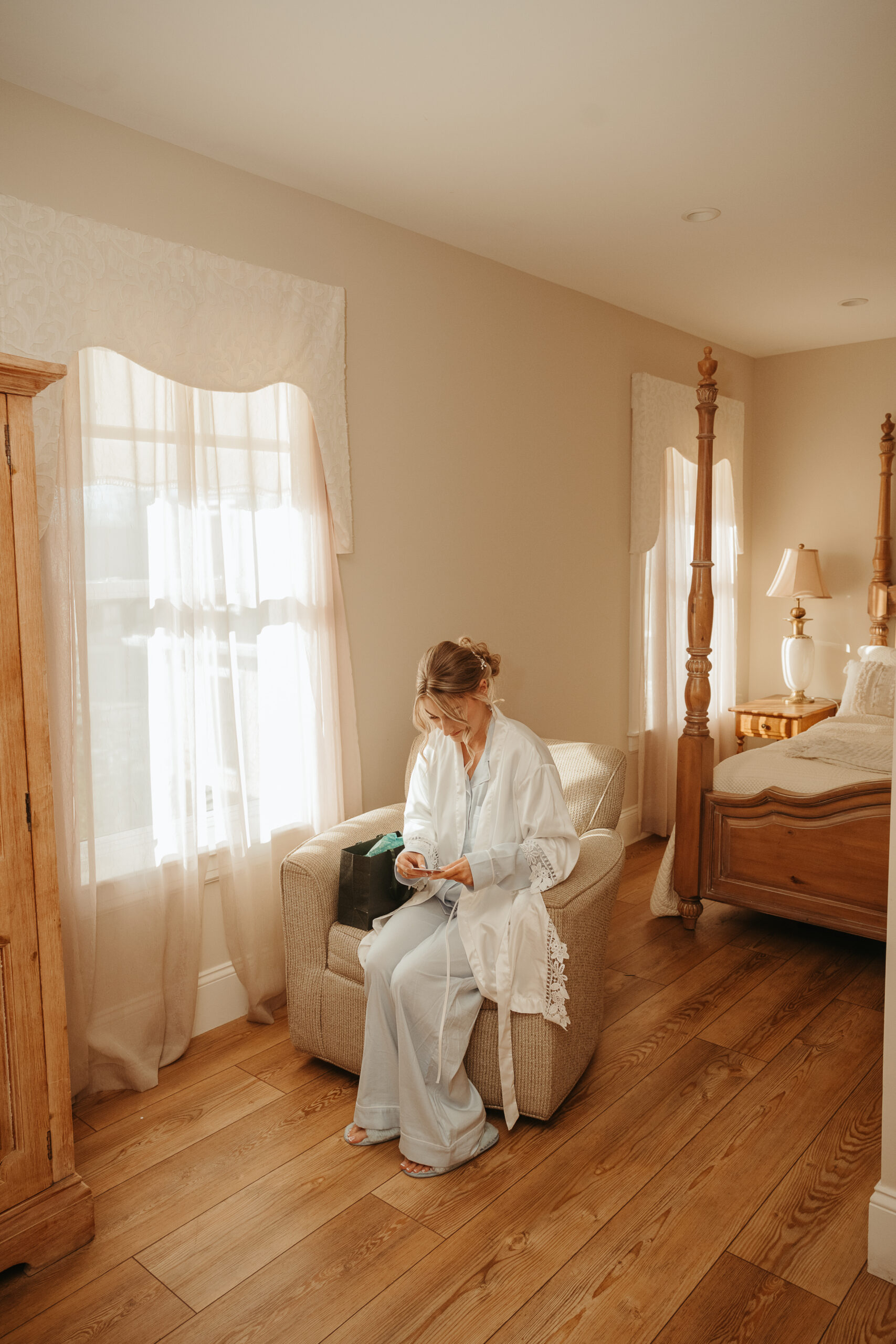 bride opening grooms gift at Stage House Inn